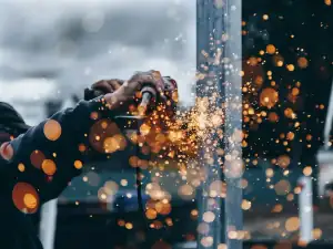 Cutting steel with a grinder, sparks flying