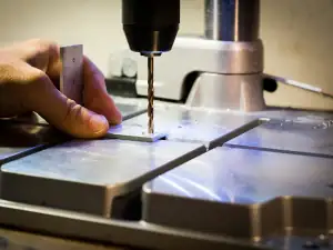 Drilling a hole through a steel plate