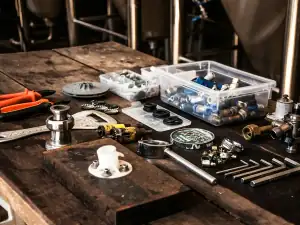 Fittings and small parts laid out on a bench