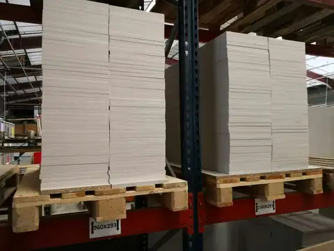 Board sheets stacked on pallets